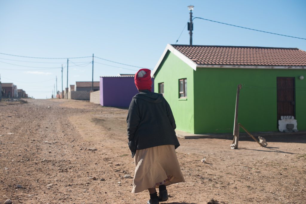 Woman walking in township in Eastern Cape
