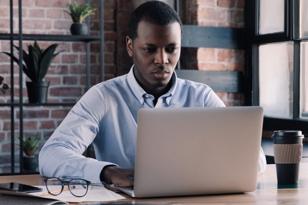 Government operations official working at remote desk